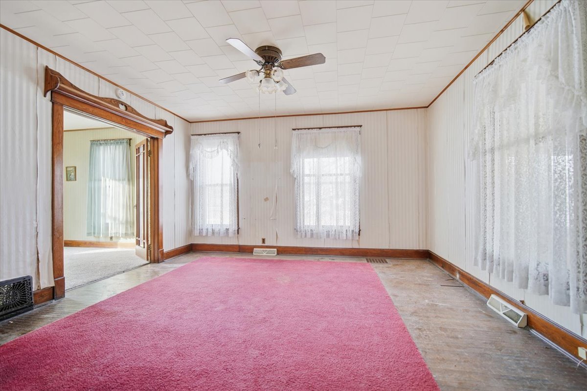 410 North Main Street Le Roy, IL 61752 - Photo 3 of 23 a view of an empty room with a window