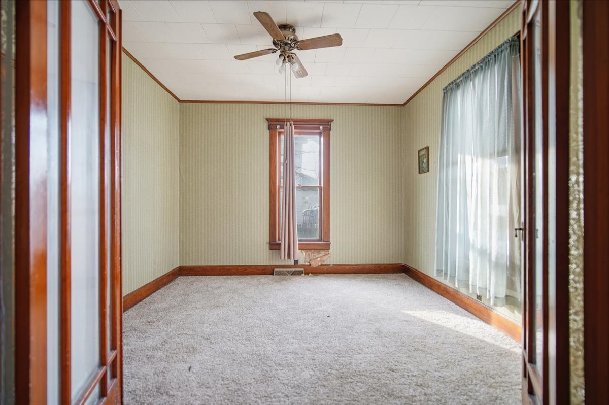 410 North Main Street Le Roy, IL 61752 - Photo 4 of 23 a view of an empty room and a window