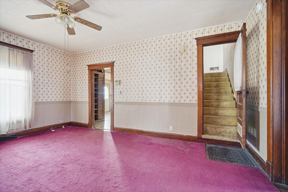 410 North Main Street Le Roy, IL 61752 - Photo 9 of 23 an empty room with windows and closet