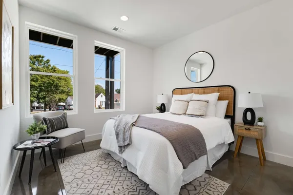 a bedroom with bed and a window