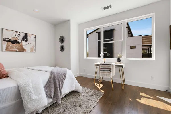 a bed room with a bed and a couch