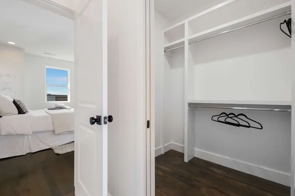 a spacious bathroom with a double vanity sink and mirror