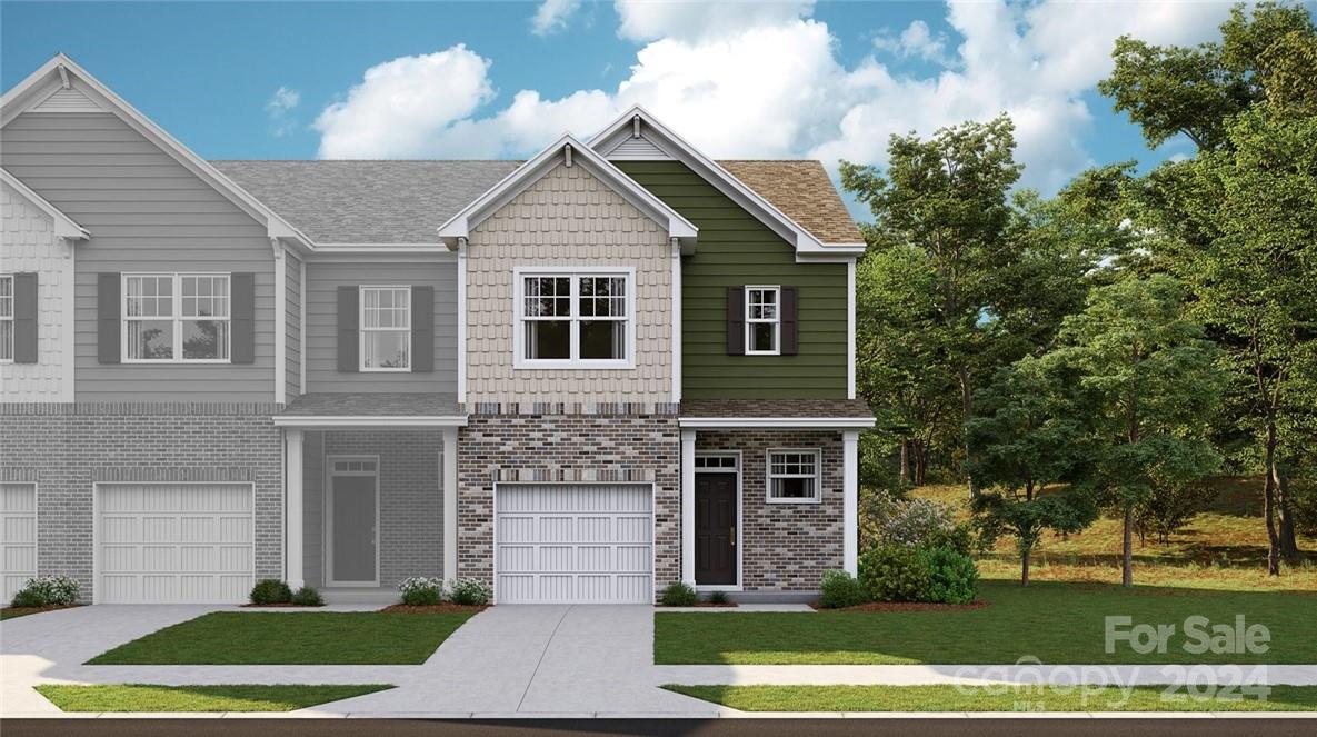 6051 Chelsea Oaks Ridge, Unit 2071 Tega Cay, SC 29708 - Photo 1 of 12 a front view of a house with a yard