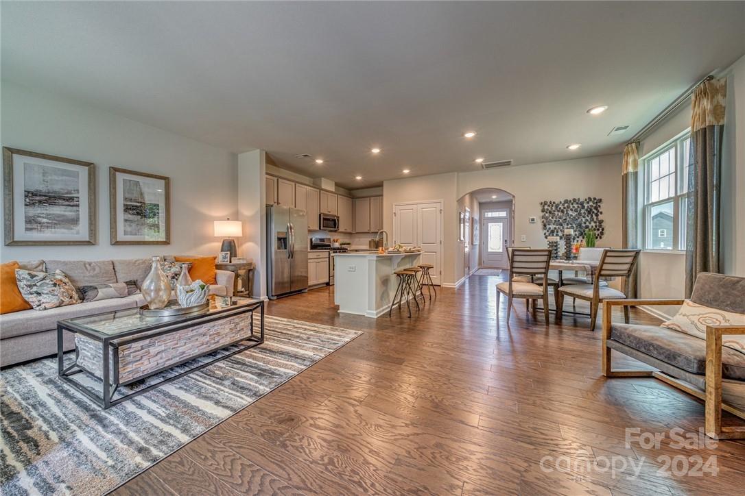 6051 Chelsea Oaks Ridge, Unit 2071 Tega Cay, SC 29708 - Photo 2 of 12 a living room with furniture and a table