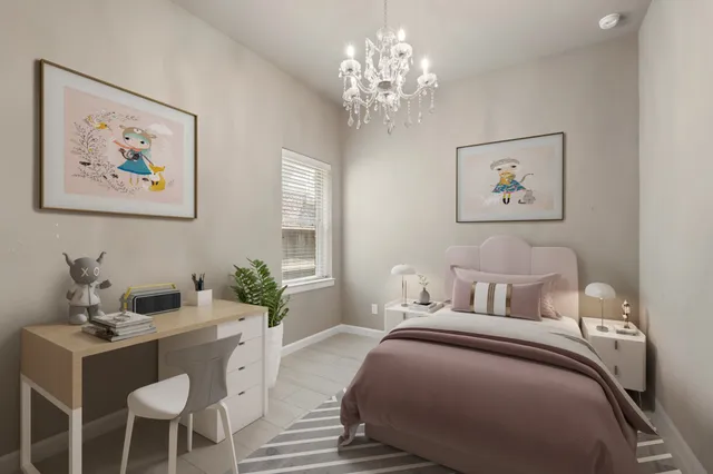 a bedroom with a bed and a chandelier