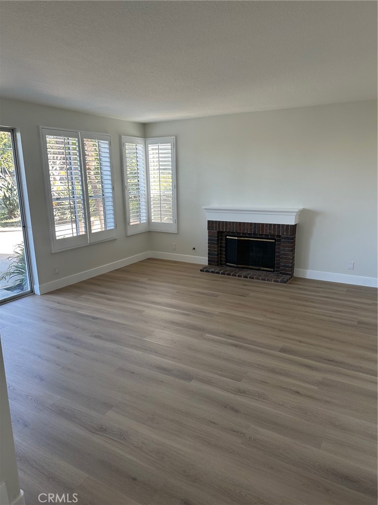 28451 Fieldbrook Mission Viejo, CA 92692 - Photo 14 of 43 wooden floor chandelier and windows in a room