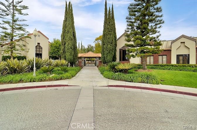 28451 Fieldbrook Mission Viejo, CA 92692 - Photo 35 of 43 a front view of a house with a yard and potted plants