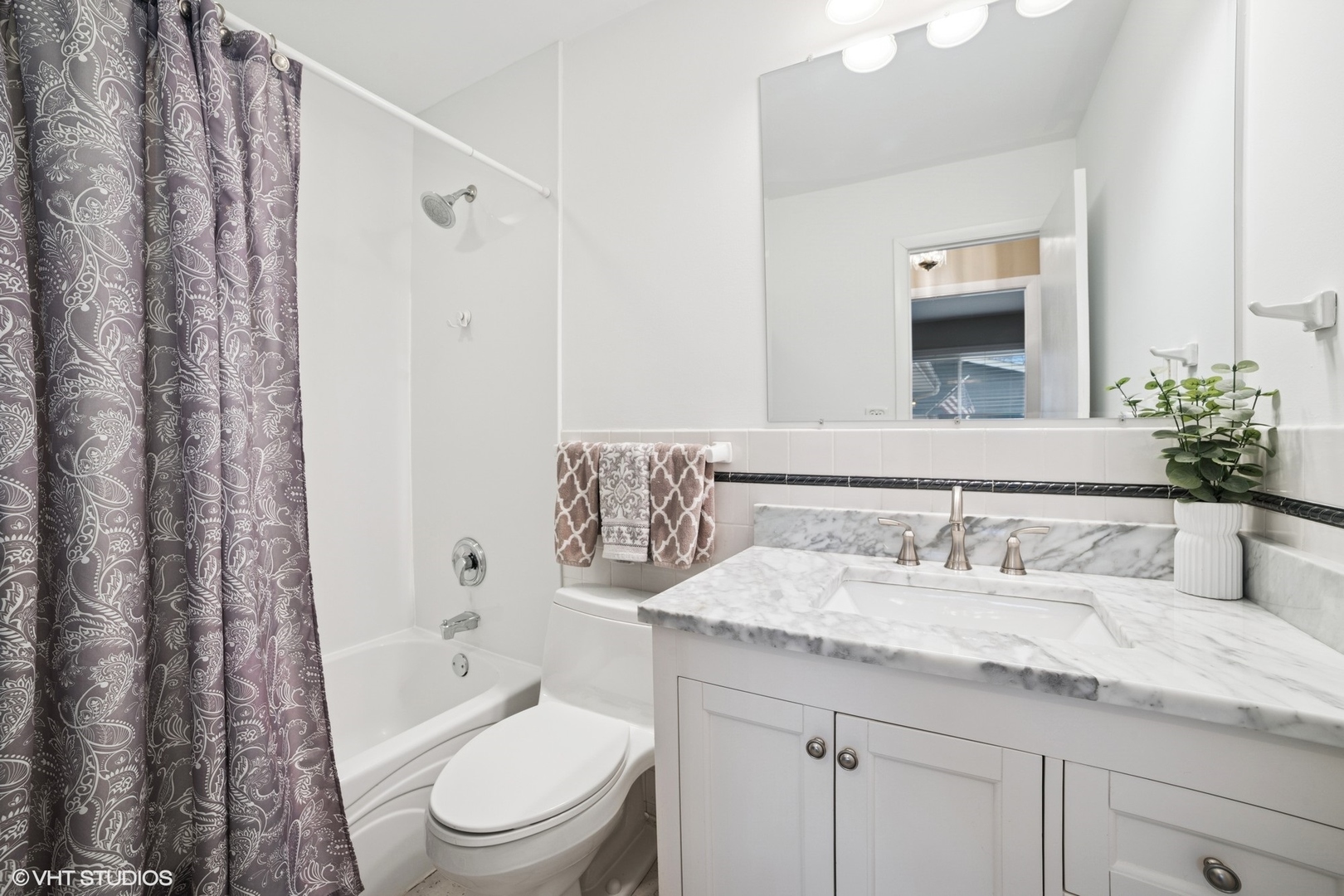 720 Alcoa Lane Hoffman Estates, IL 60169 - Photo 12 of 23 a bathroom with a granite countertop sink a toilet and a mirror