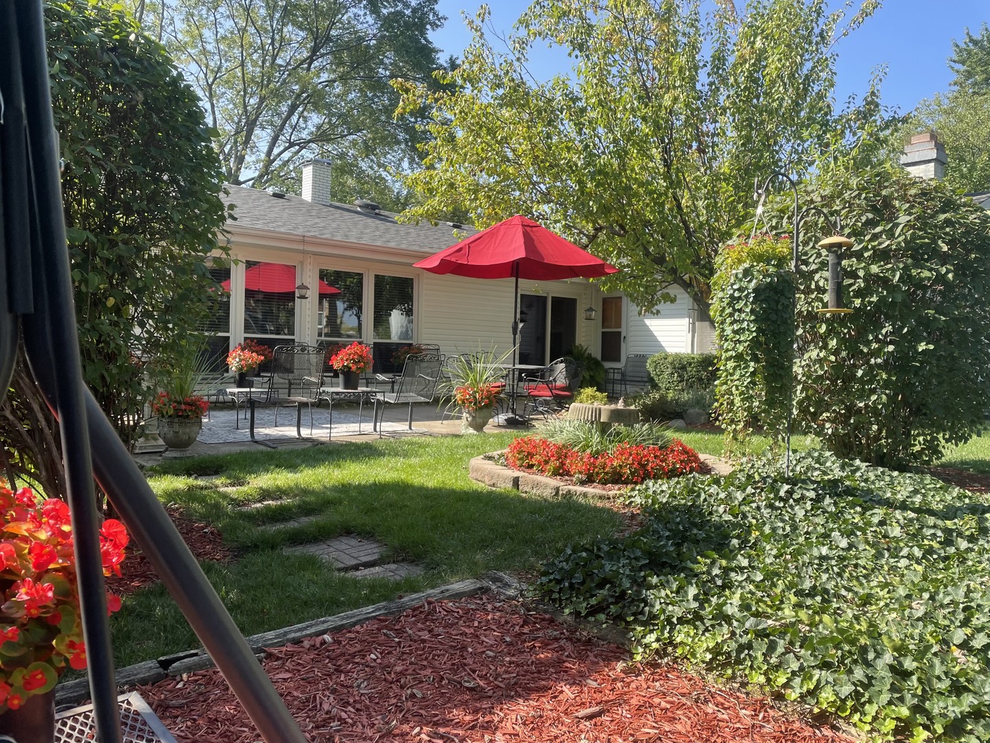 720 Alcoa Lane Hoffman Estates, IL 60169 - Photo 21 of 23 a view of swimming pool with a table and chairs under an umbrella