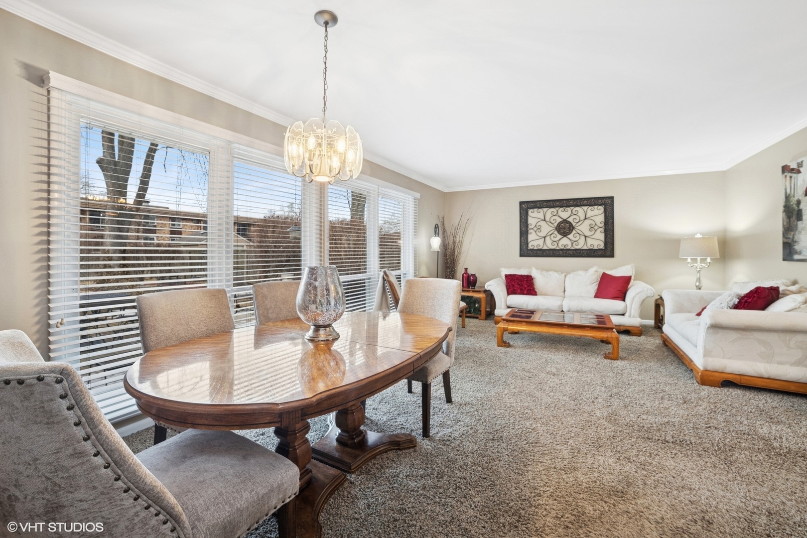 720 Alcoa Lane Hoffman Estates, IL 60169 - Photo 3 of 23 a living room with furniture and a chandelier