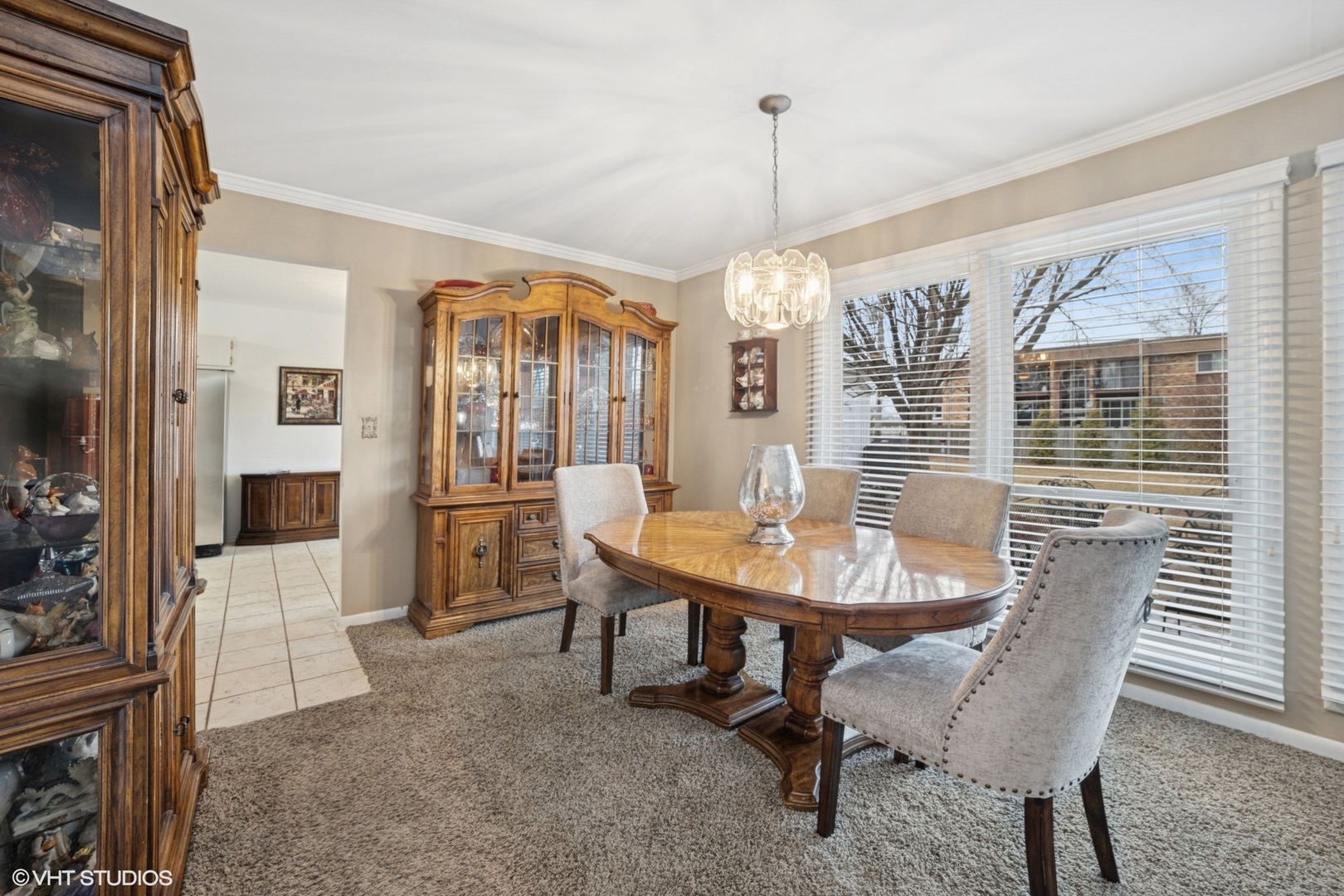 720 Alcoa Lane Hoffman Estates, IL 60169 - Photo 4 of 23 a view of a dining room with furniture window and wooden floor
