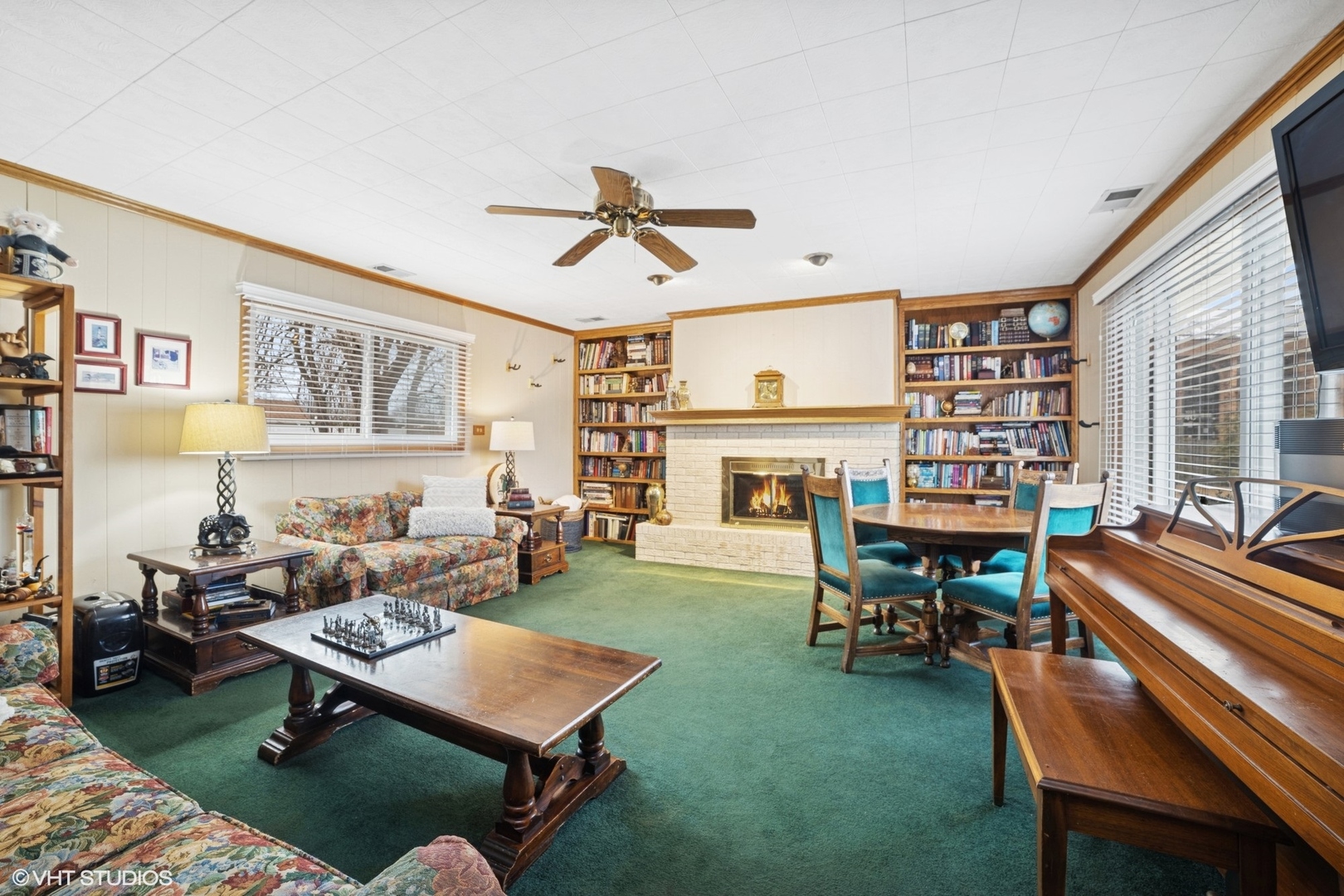 720 Alcoa Lane Hoffman Estates, IL 60169 - Photo 8 of 23 a living room with furniture a rug and a fireplace