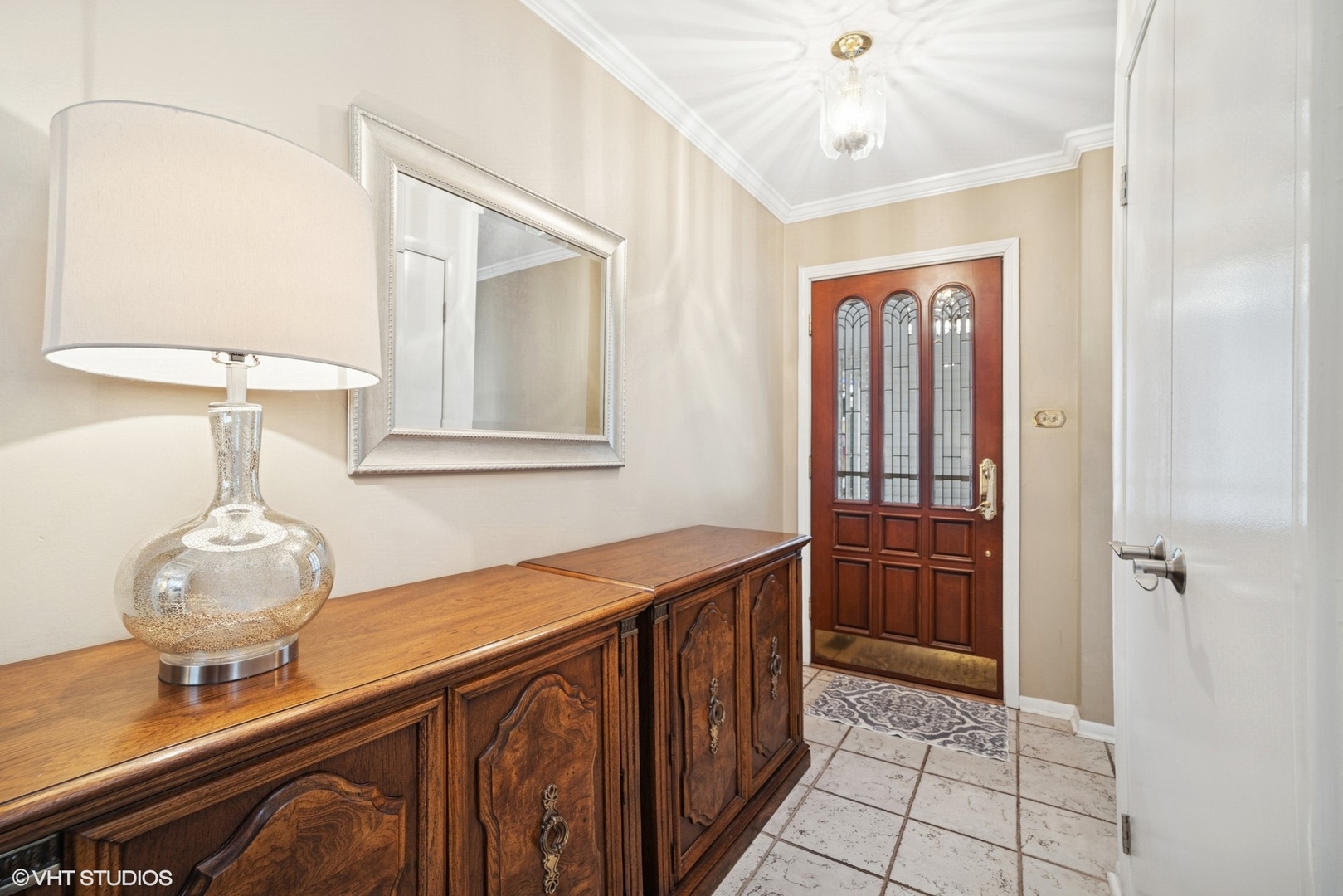 720 Alcoa Lane Hoffman Estates, IL 60169 - Photo 9 of 23 a view of a hallway view with wooden floor and staircase