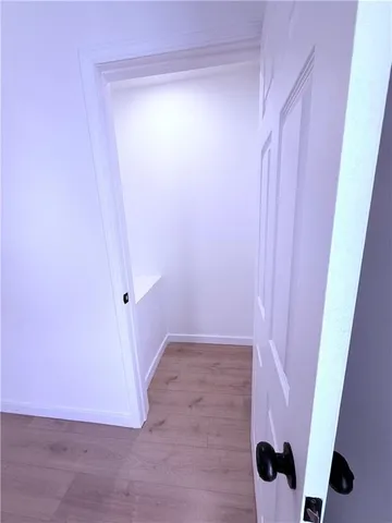 a view of a room with wooden walls