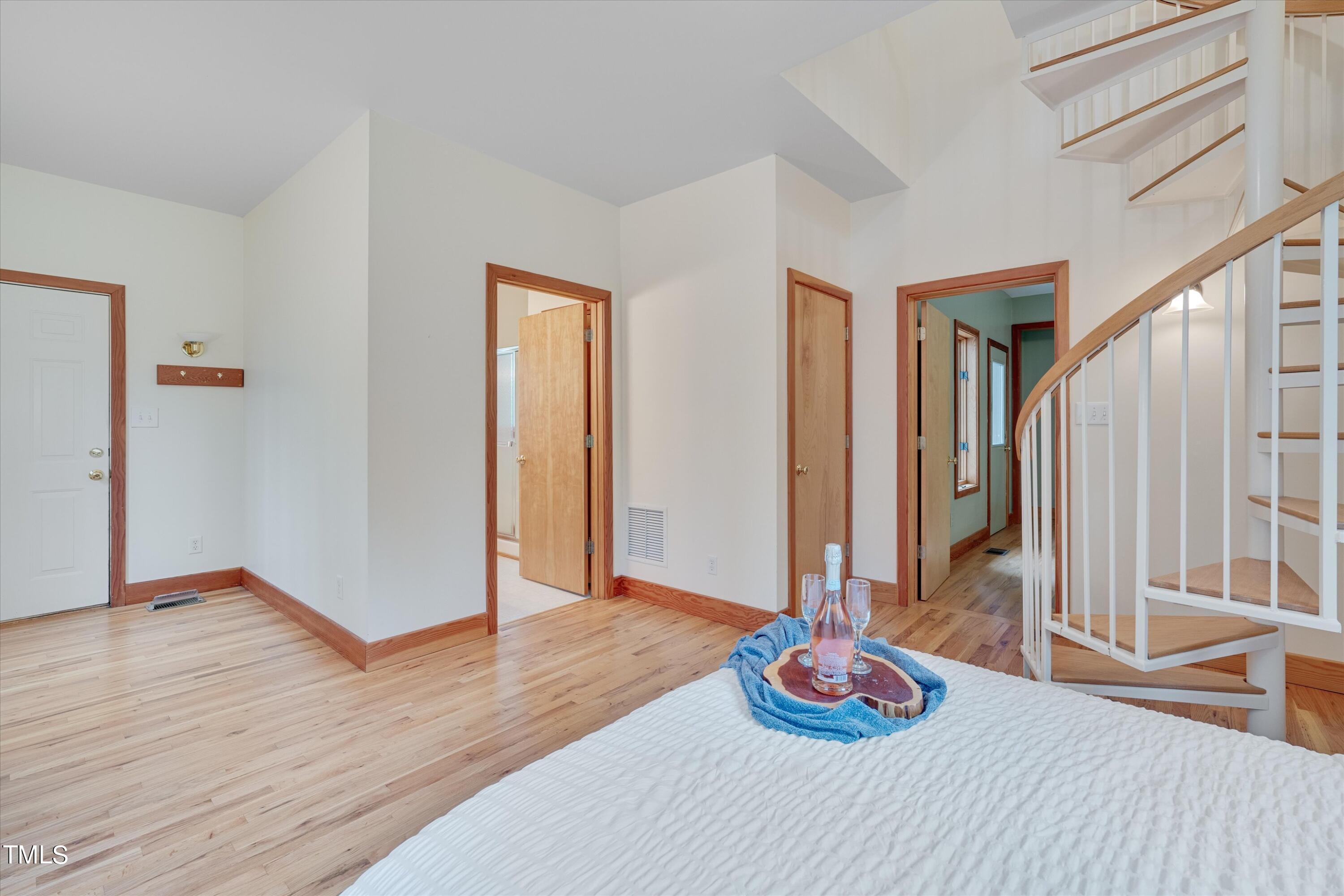 377 Potluck Farm Road Rougemont, NC 27572 - Photo 20 of 54 The first floor primary bedroom with a separate sitting area, loft, and access to the large back deck.