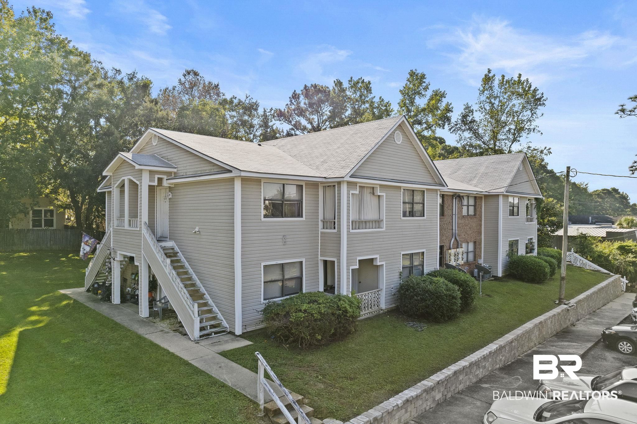 110 5th Street, Unit C103 Daphne, AL 36526 - Photo 2 of 46 View of side of property with a yard