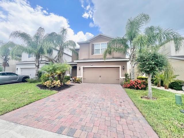 3901 Crawley Down Loop Sanford, FL 32773 - Photo 1 of 1 a front view of house with yard and green space