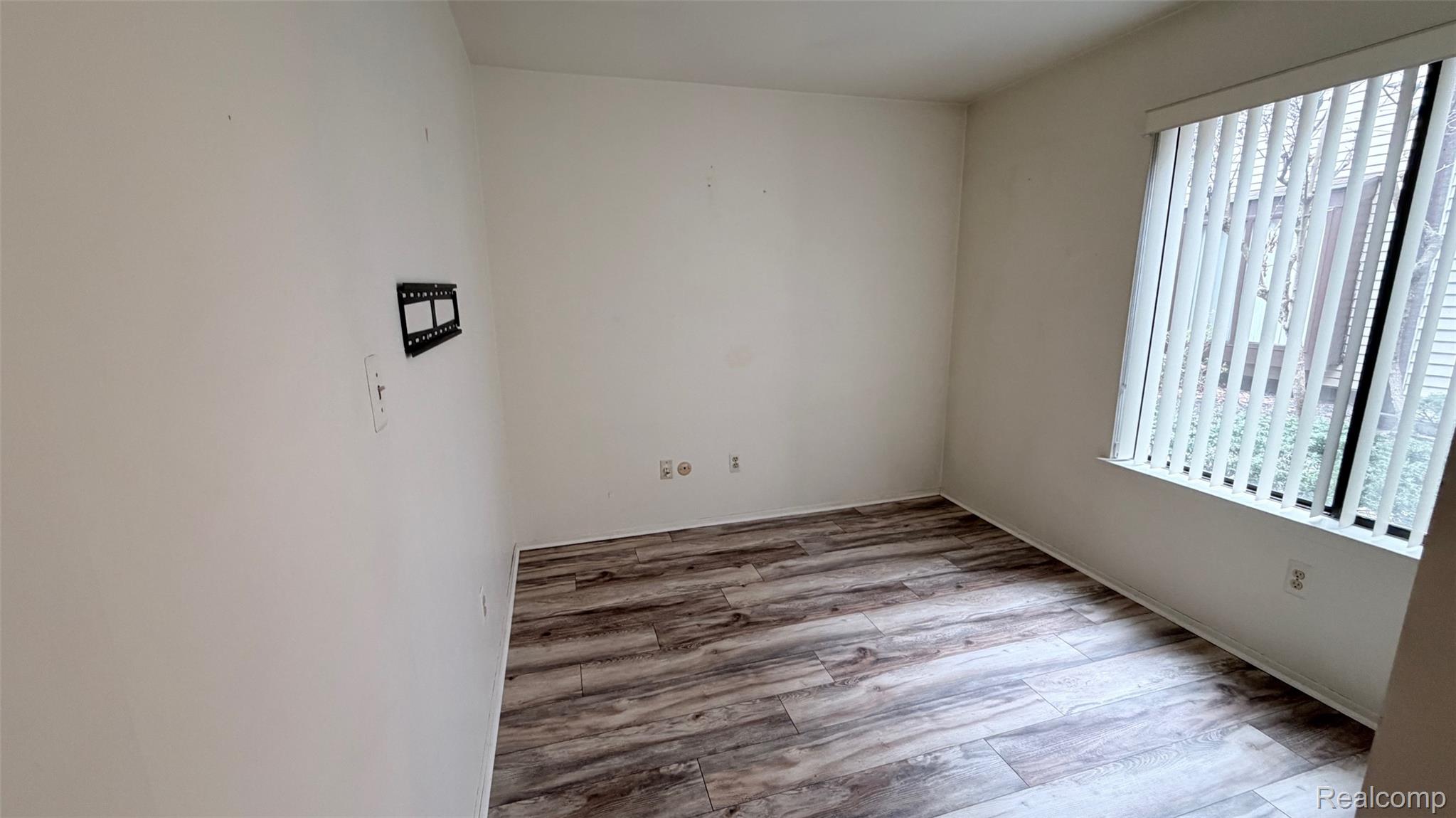 24219 Evergreen Road, Unit 39 Southfield, MI 48075 - Photo 5 of 11 Spare room with light wood-type flooring