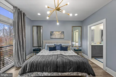 a bedroom with a bed and a couch