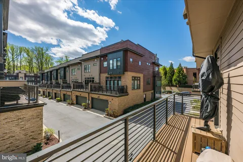 a spacious bedroom with a large bed and a chandelier
