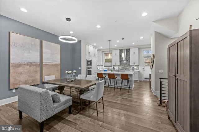 a view of a dining room with furniture and window