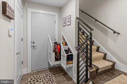 a view of entryway with stairs and wooden floor