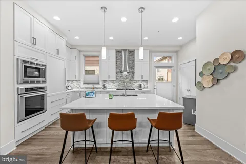 a view of a hallway and wooden floor