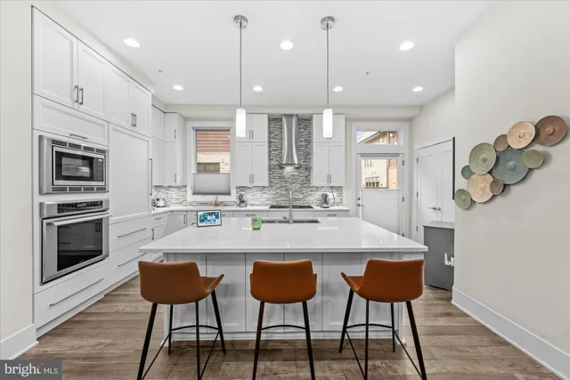 a view of a hallway and wooden floor