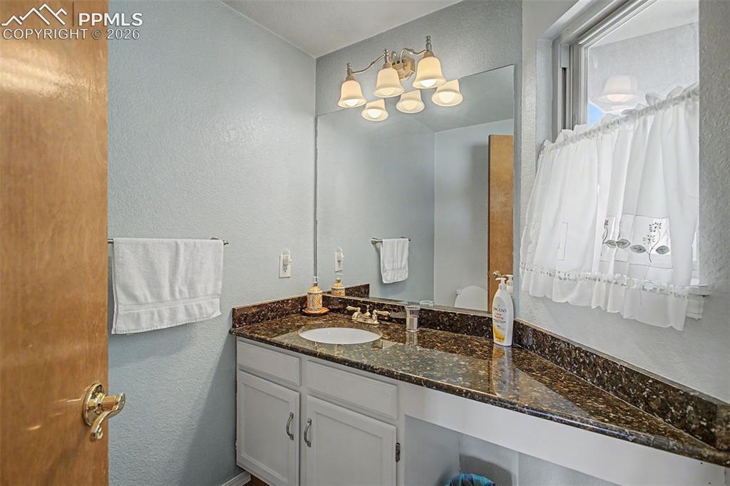 2345 Ramsgate Terrace Colorado Springs, CO 80919 - Photo 20 of 46 Main level 1/2 bathroom.