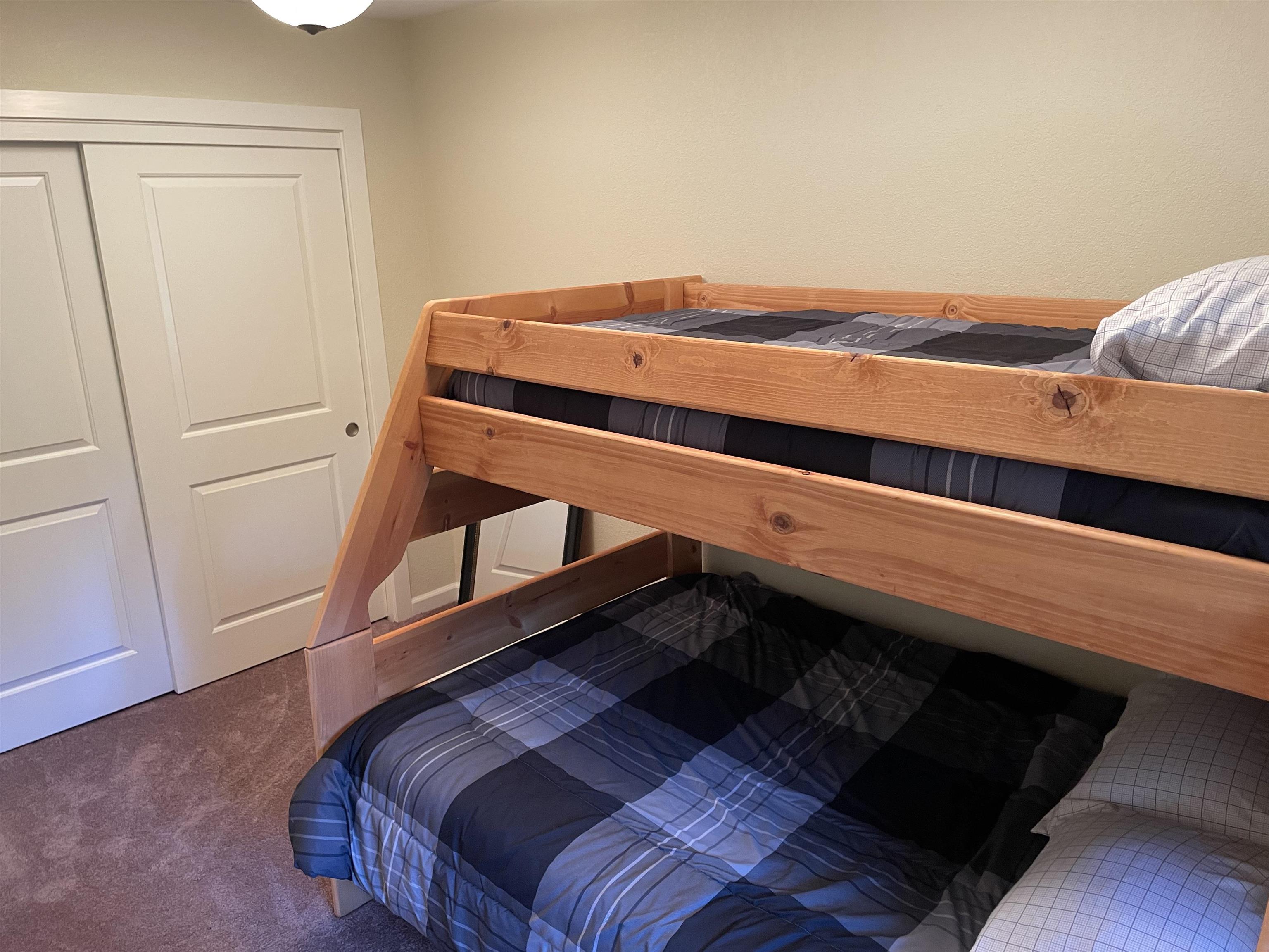 831 Timber Ridge Road Lake Almanor, CA 96137 - Photo 30 of 36 a bedroom with a bed and the view of closet