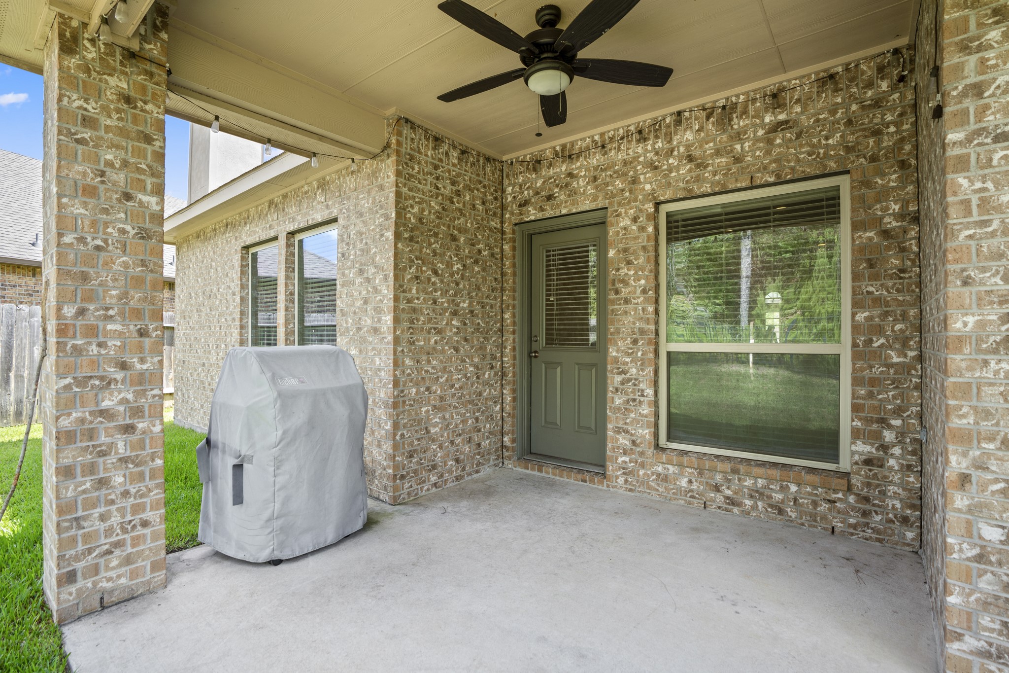 5319 Claymore Meadow Lane Spring, TX 77389 - Photo 28 of 34 a view of a porch with a floor to ceiling window and front door