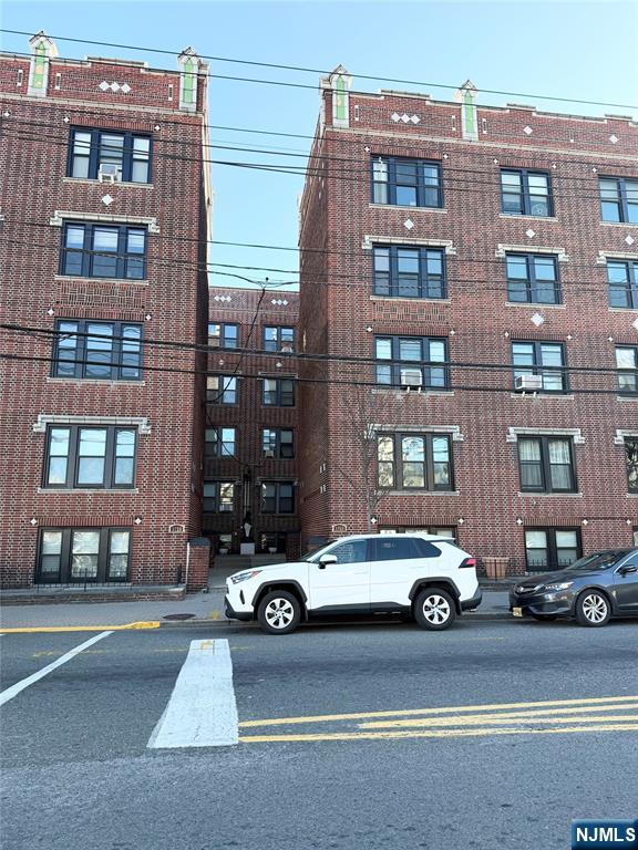 3718 Park Avenue, Unit D4 Weehawken, NJ 07086 - Photo 25 of 25 a car parked in front of a building