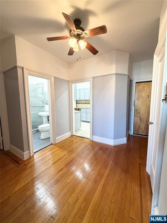 3718 Park Avenue, Unit D4 Weehawken, NJ 07086 - Photo 5 of 25 a view of an empty room with wooden floor and a window