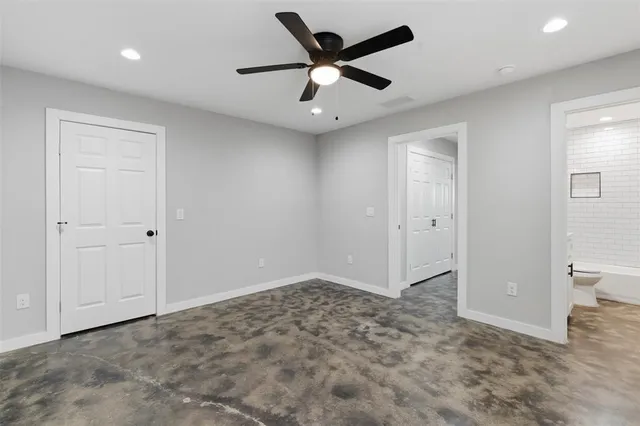 a view of an empty room and closet area
