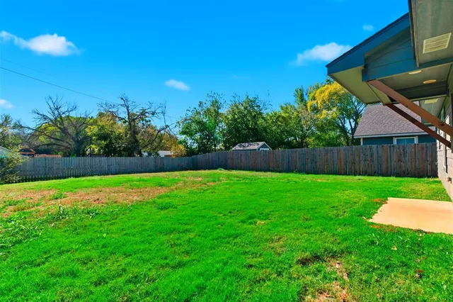 a view of a backyard with green space