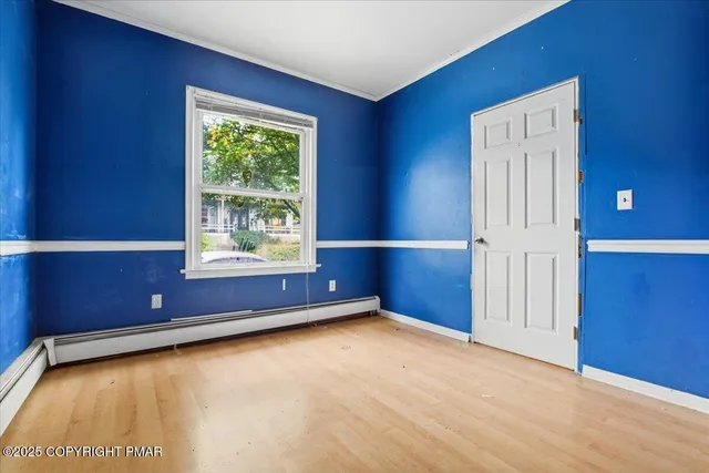 a view of an empty room with a window