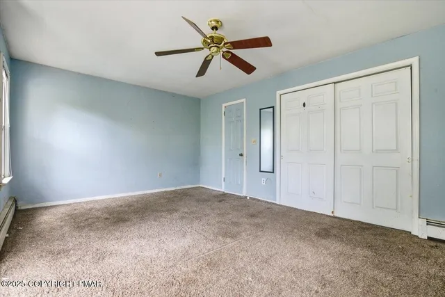 a bathroom with a toilet a sink a bath tub and a window