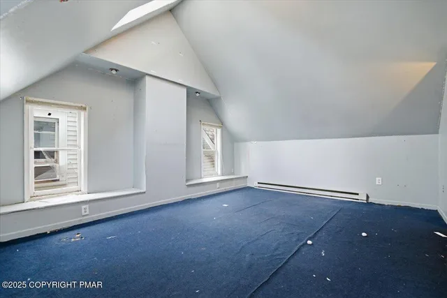 an empty room with closet and mirror