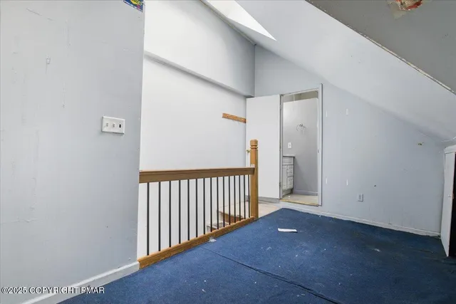 a bathroom with a shower sink and mirror