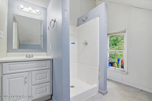 a a bathroom view of a toilet and a shower