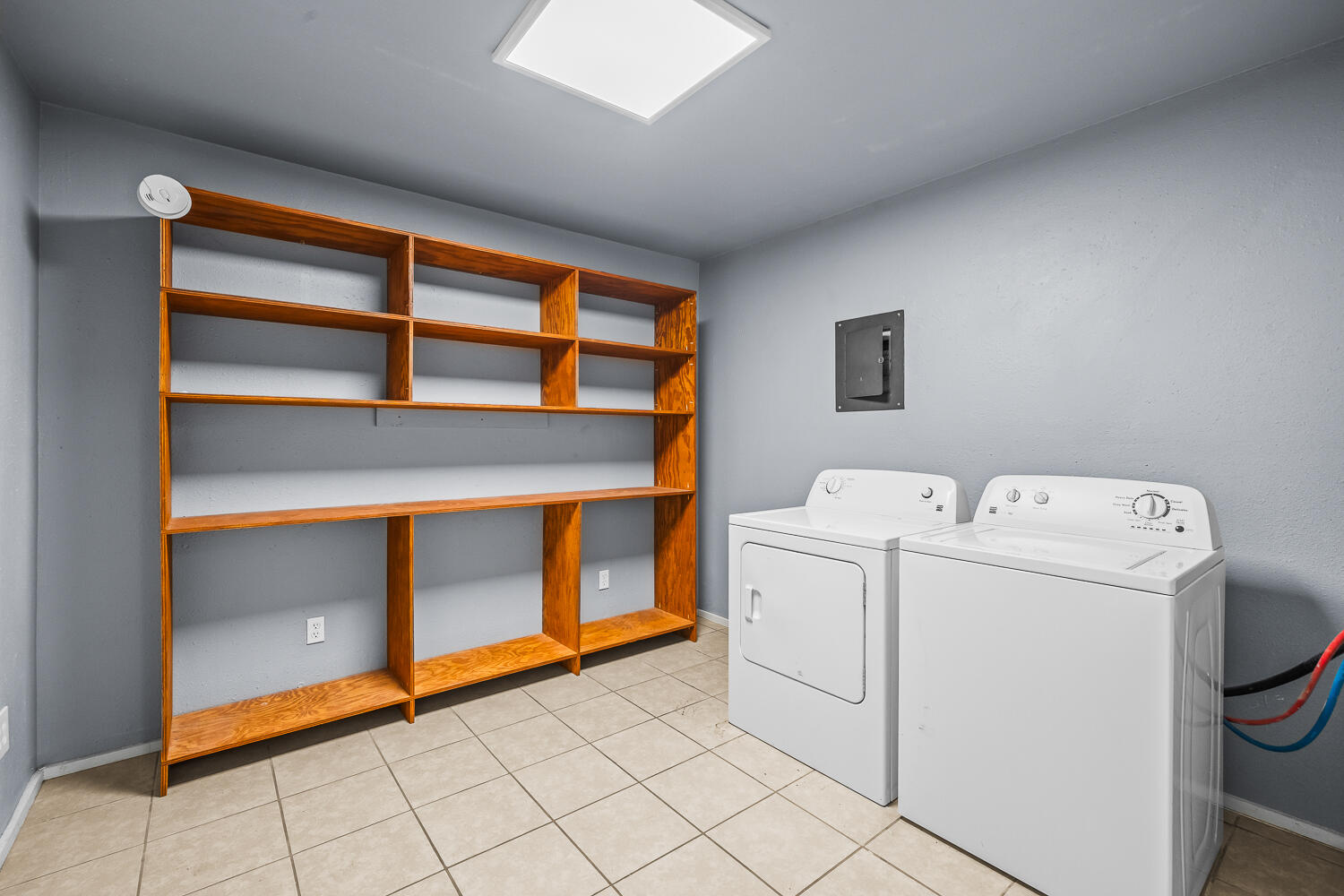 5522 17th Street Lubbock, TX 79416 - Photo 11 of 22 a utility room with dryer and washer