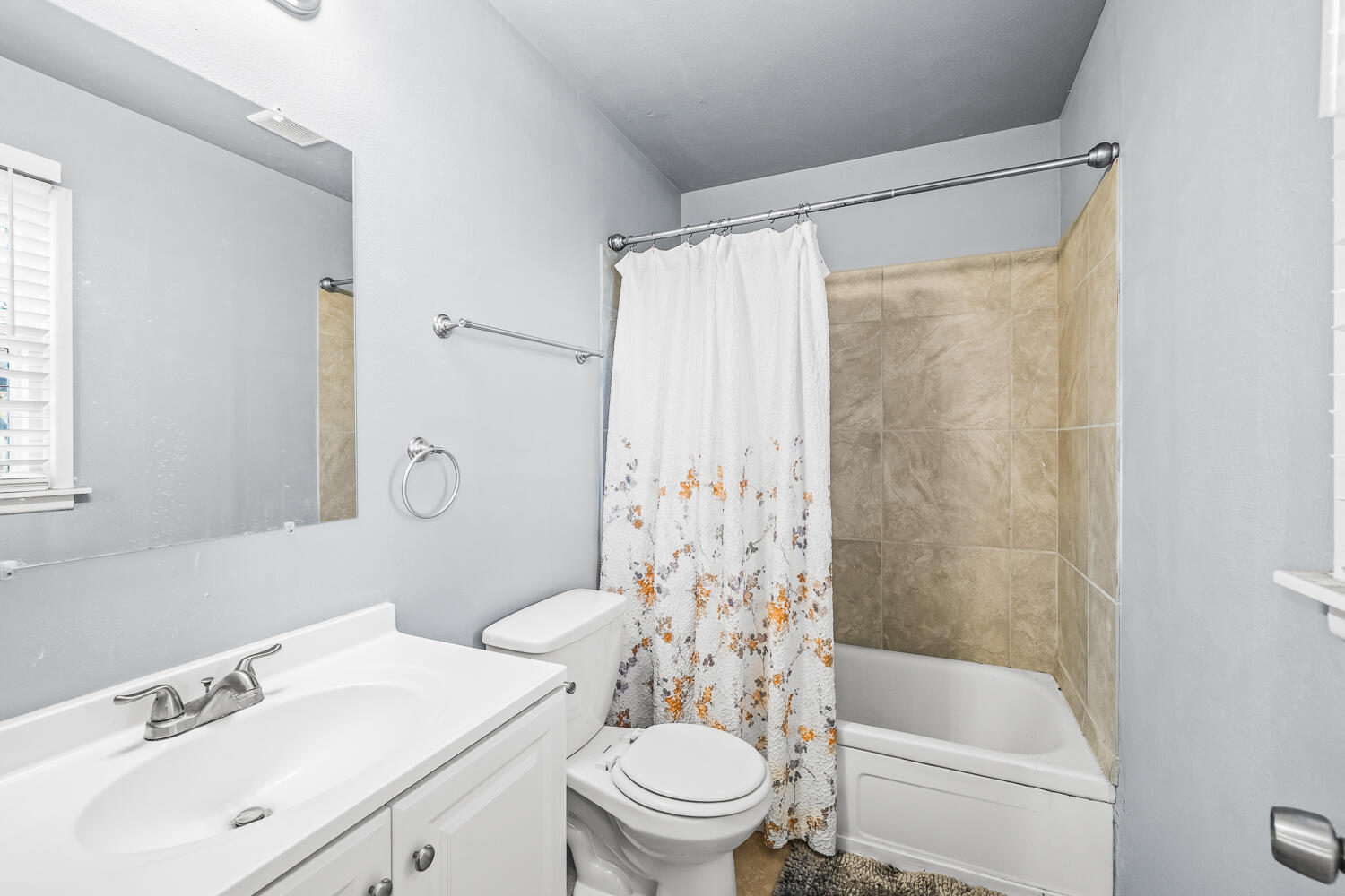 5522 17th Street Lubbock, TX 79416 - Photo 14 of 22 a bathroom with a sink a toilet and a shower