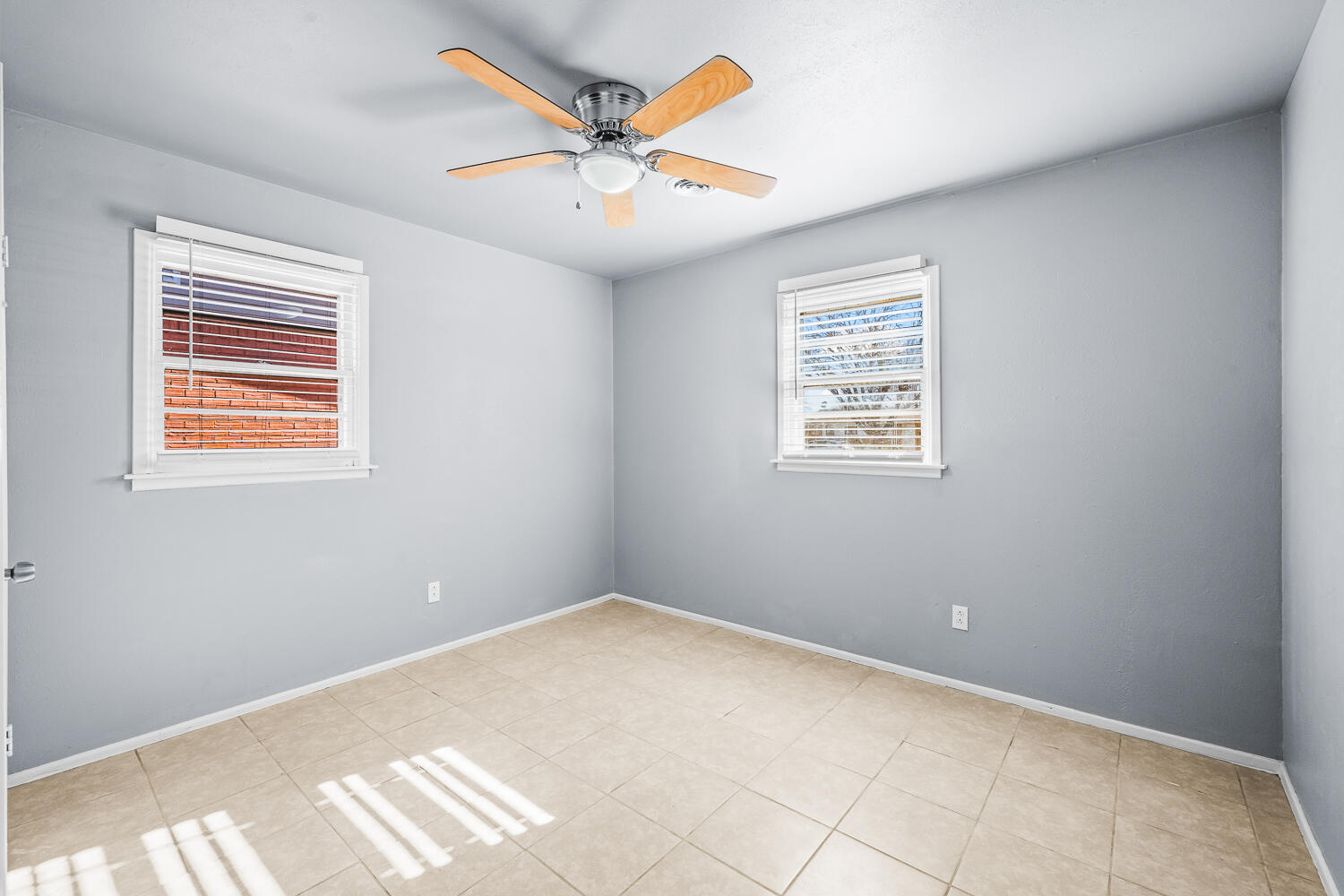 5522 17th Street Lubbock, TX 79416 - Photo 16 of 22 a view of an empty room with a window