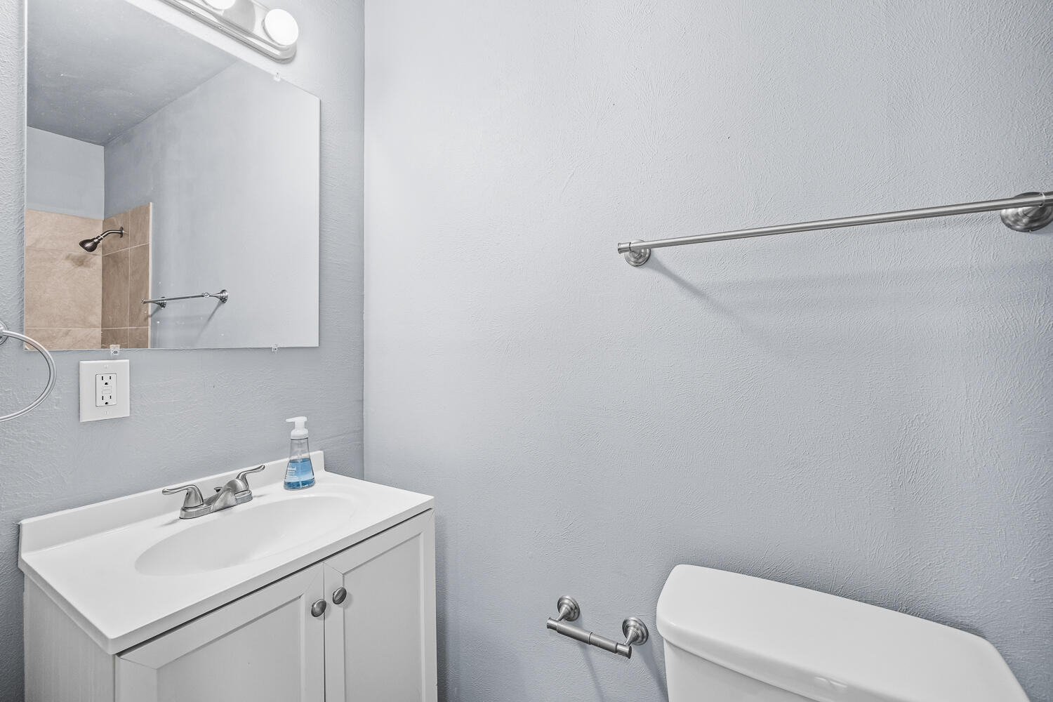 5522 17th Street Lubbock, TX 79416 - Photo 20 of 22 a bathroom with a sink a toilet and vanity