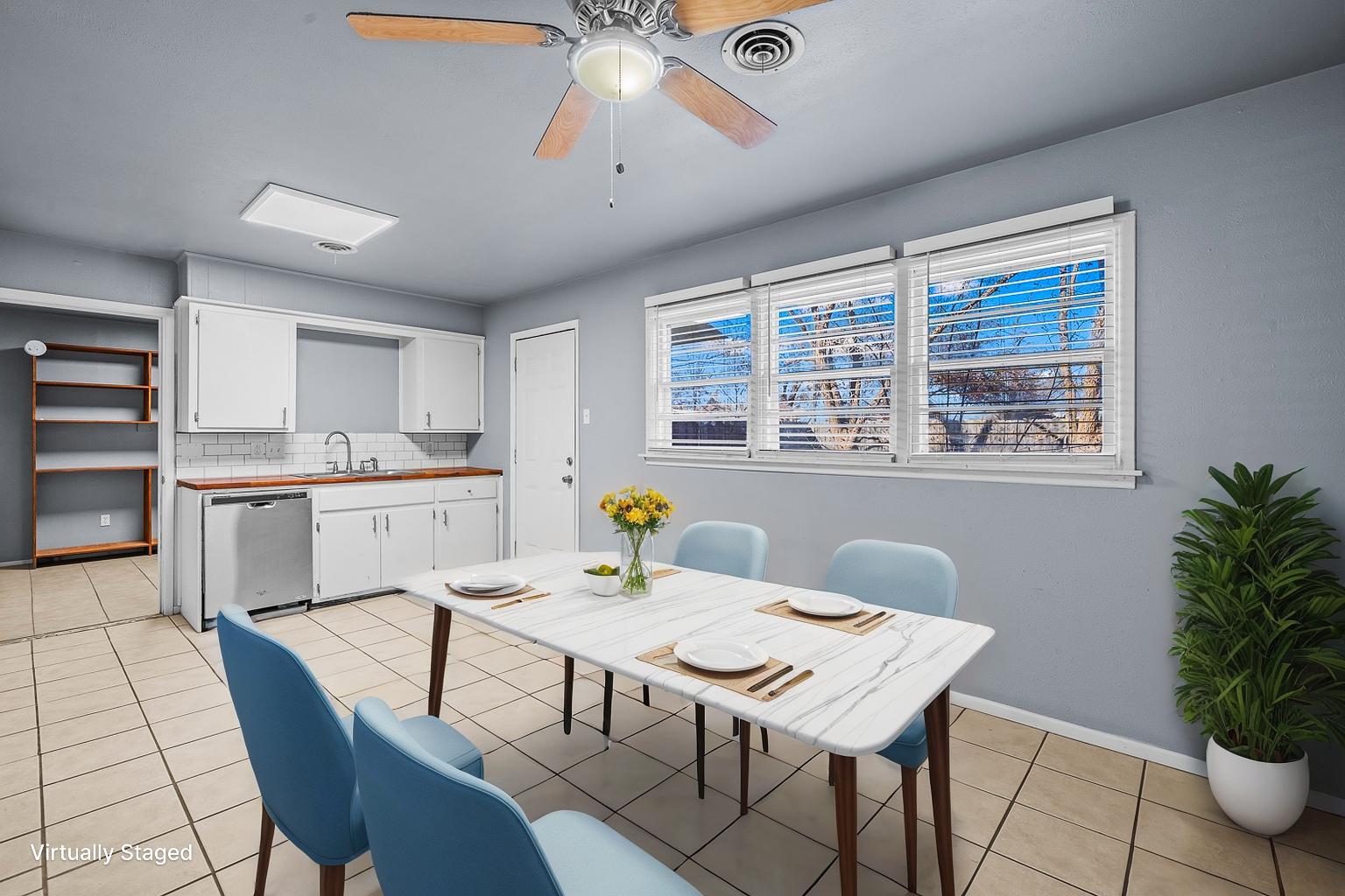 5522 17th Street Lubbock, TX 79416 - Photo 6 of 22 a view of a dining room with furniture and window