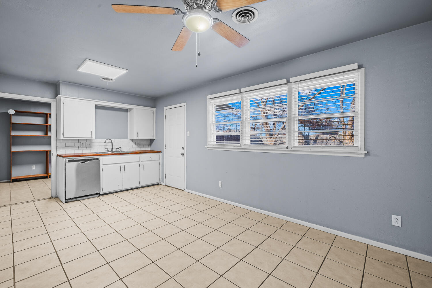 5522 17th Street Lubbock, TX 79416 - Photo 7 of 22 a view of an empty room with a window