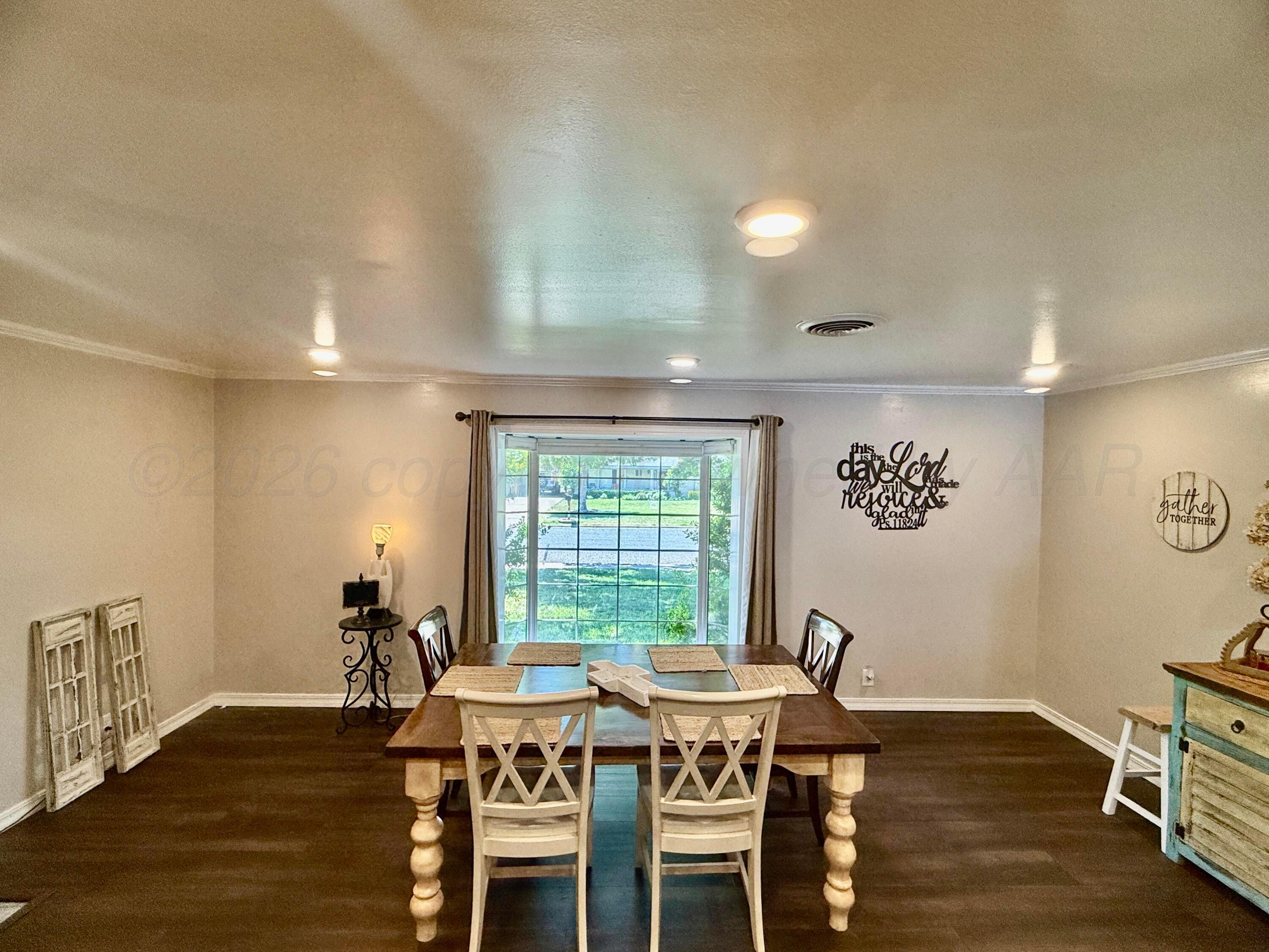 219 Inverness Street Borger, TX 79007 - Photo 12 of 35 a view of a dining room with furniture window and wooden floor