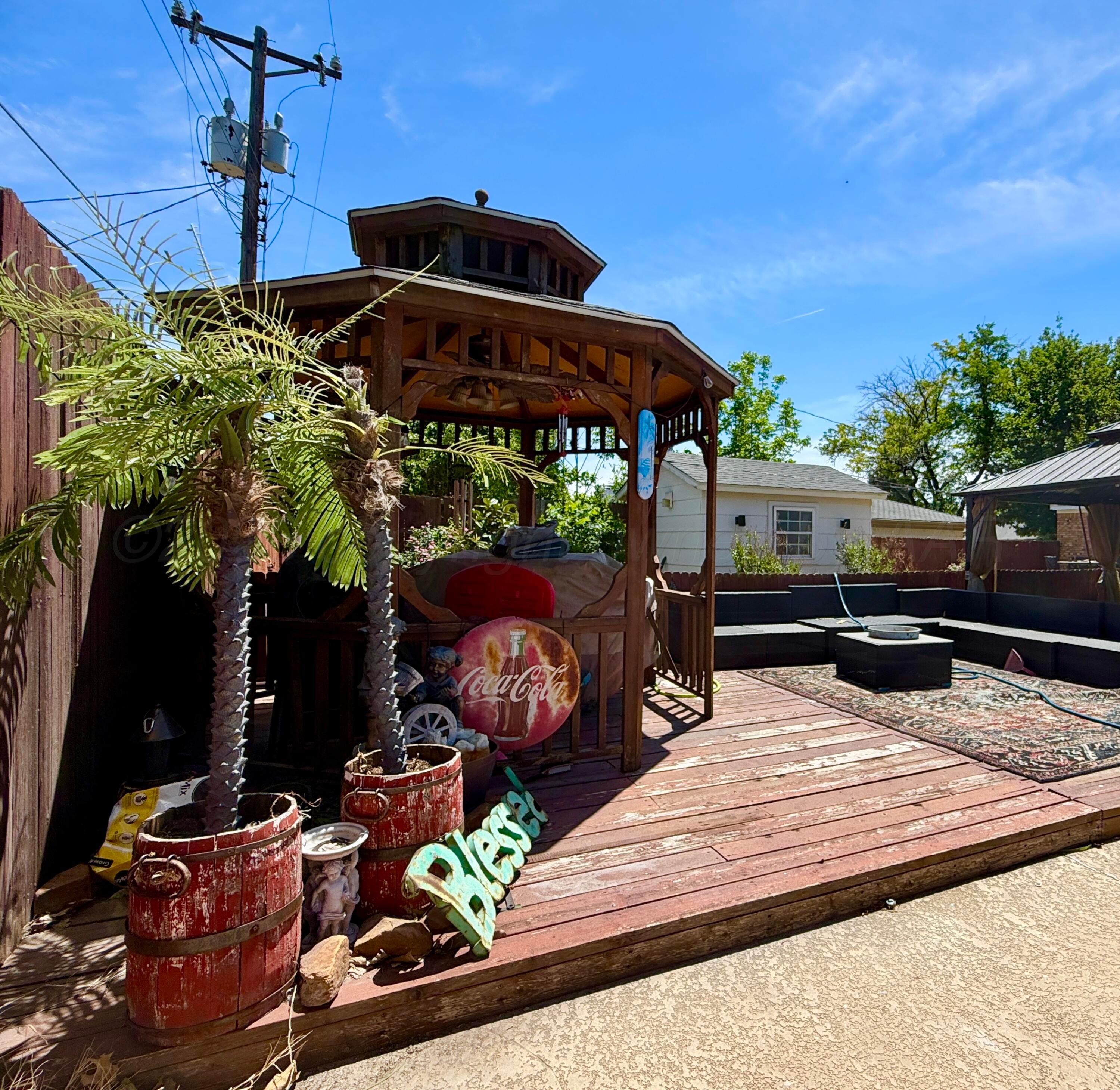 219 Inverness Street Borger, TX 79007 - Photo 33 of 35 a view of a patio with table and chairs potted plants