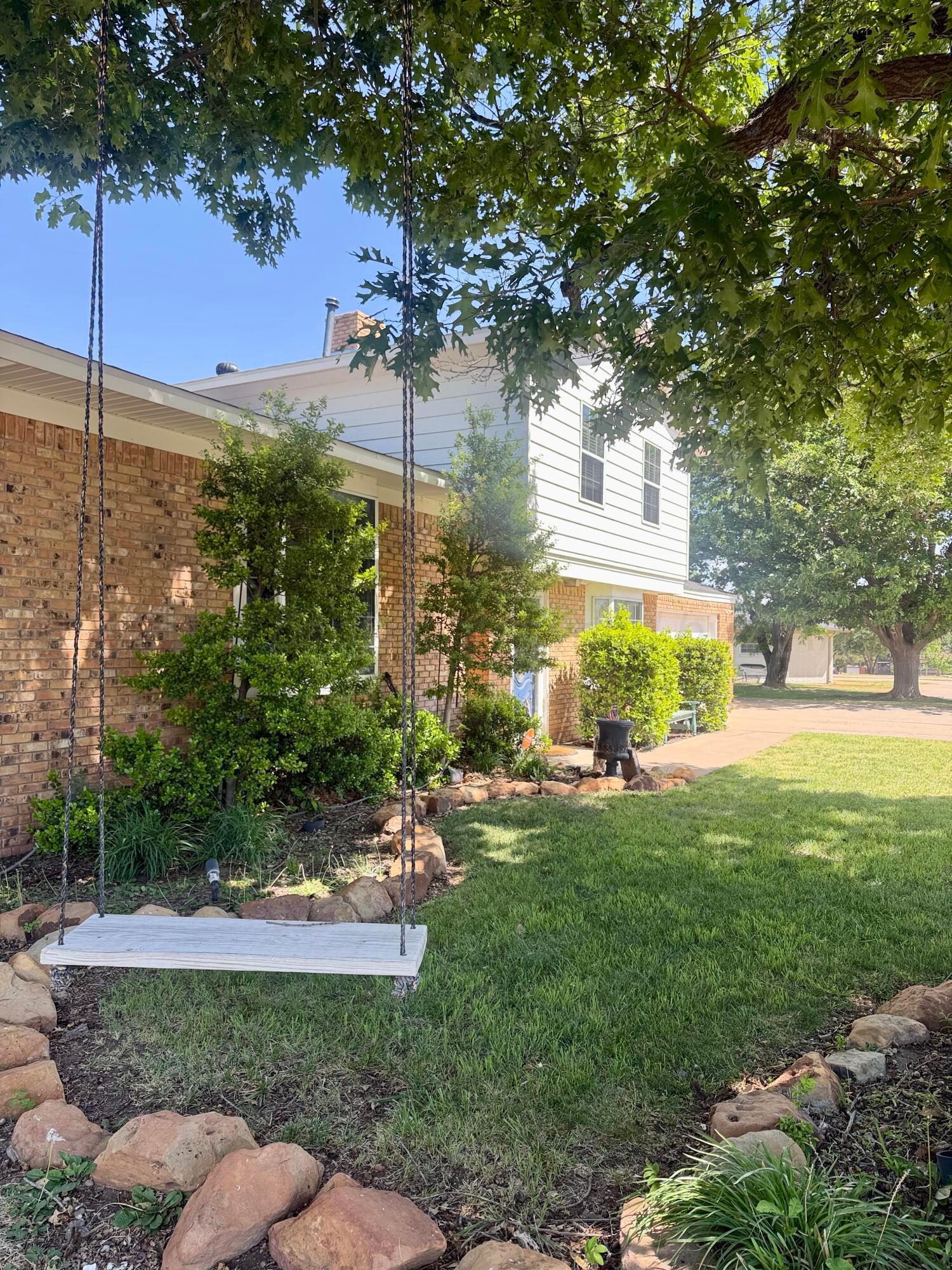 219 Inverness Street Borger, TX 79007 - Photo 4 of 35 a view of a garden with a tree