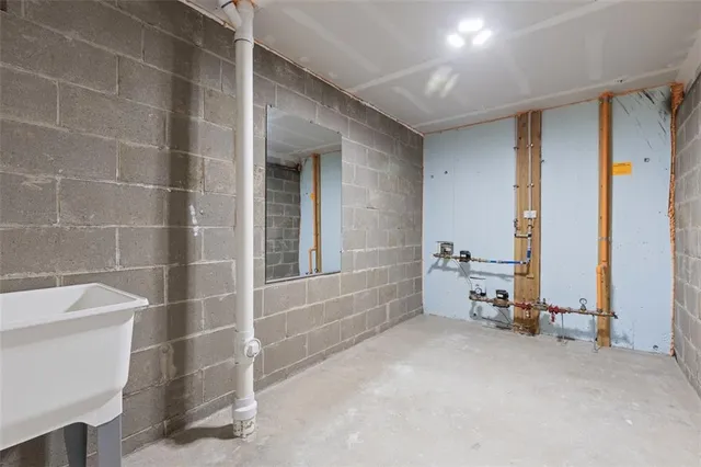 a bathroom with a tub and a sink